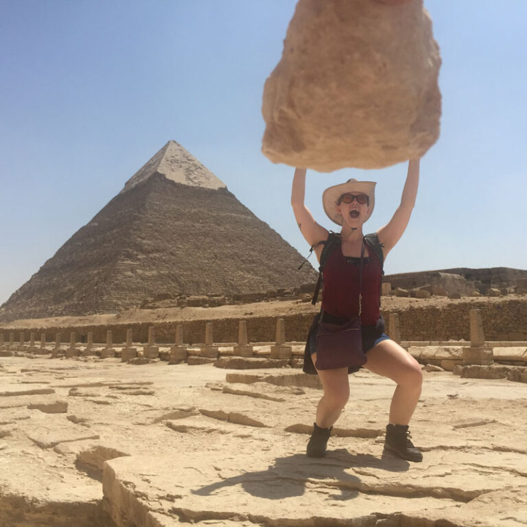 Solo female traveler exploring the Pyramids of Giza, Cairo, Egypt