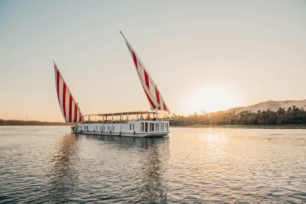 luxury Dahabiya sailing boat on the Nile at sunset