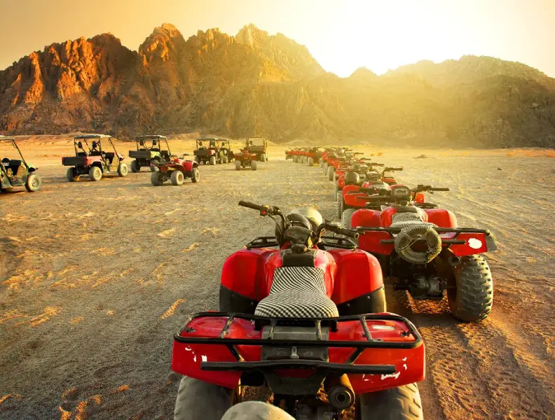 quad biking in Sharm El Sheikh desert at sunset