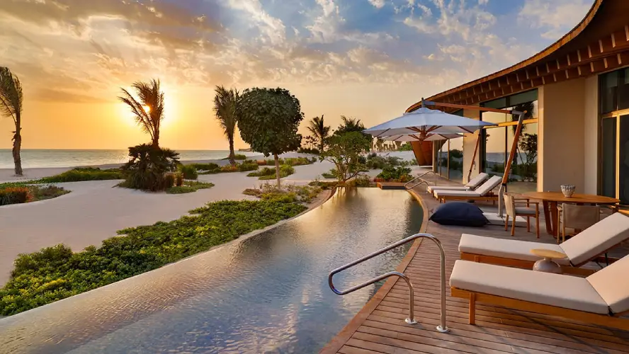 Luxury Red Sea resort pool overlooking the sea at sunset
